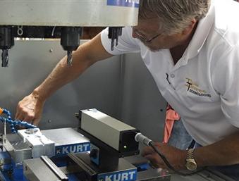 CNC service technician performing field calibration